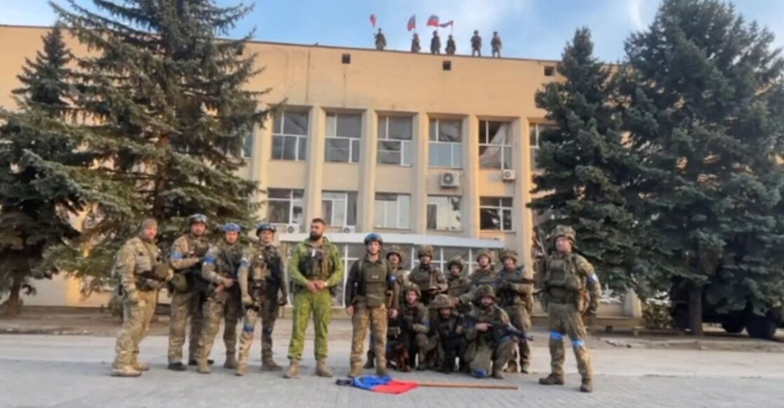 Ukrainian armed forces make a statement in front of Lyman Town Administration office, in Lyman, Ukraine, in this still image taken from a social media video, released on October 1, 2022. Courtesy of 81 Airborne Brigade of the Ukrainian Armed Forces/via REUTERS