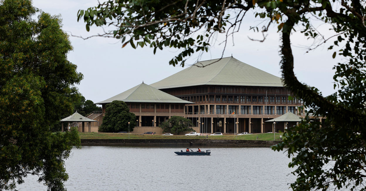 SRI-LANKA-CRISIS Security personel patrol in a boat in the premises of the Parliament building, amid the country's economic crisis in Colombo in July, 2022. File photo: Reuters/ Adnan Abidi