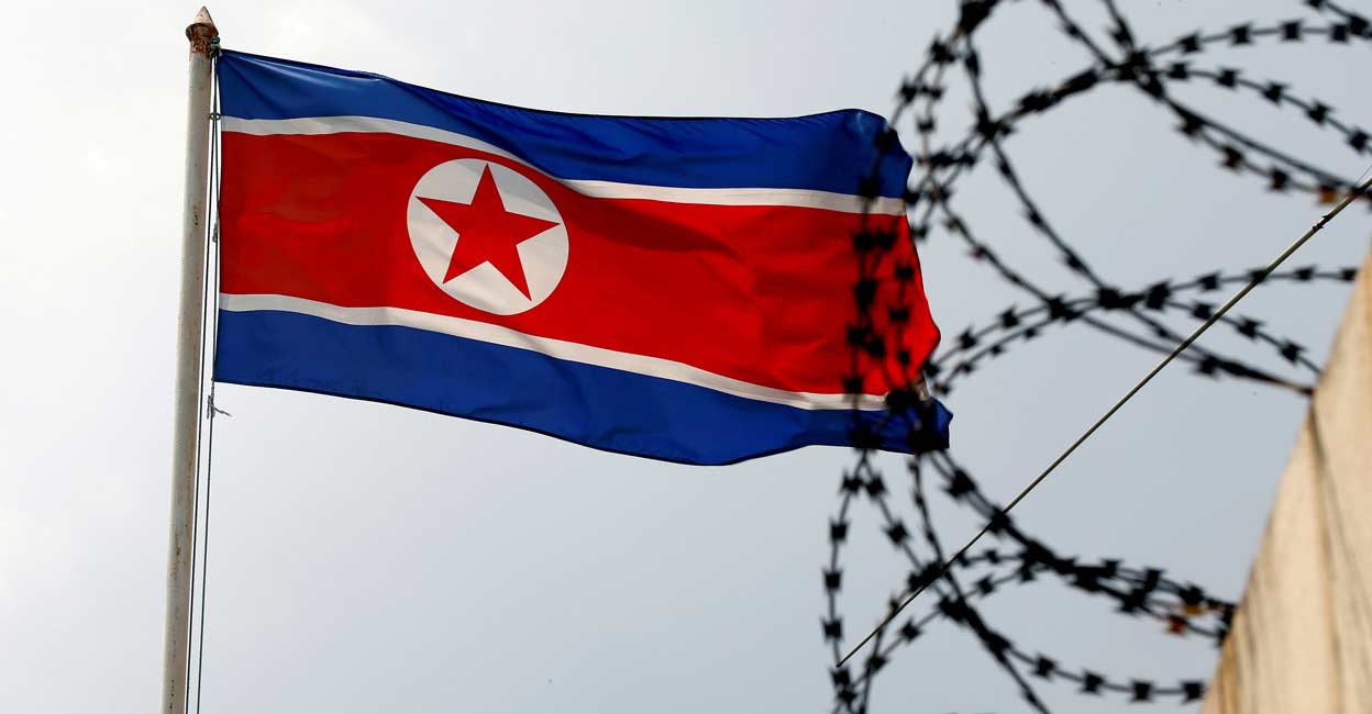 NORTHKOREA-MISSILES A North Korea flag flutters next to concertina wire at the North Korean embassy in Kuala Lumpur, Malaysia March 9, 2017. File photo: REUTERS/Edgar Su