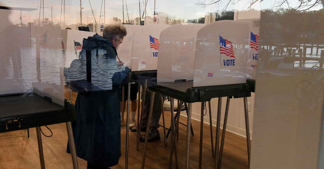 Lake Ogleton is reflected in the window as voters cast their ballots in US midterm elections at the Bay Ridge Civic Association, in Annapolis, Maryland, on Tuesday. Photo: REUTERS/Mary F. Calvert