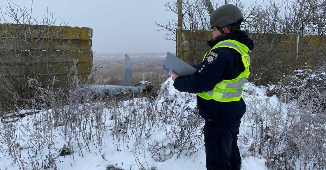 A police officer stands next to a part of a Russian cruise missile shot down by the Ukrainian Air Defence Forces, amid Russia's attack on Ukraine, in Kyiv region, Ukraine December 16, 2022. Head of the National Police of Kyiv region Andrii Nebytov via Telegram/Handout via REUTERS