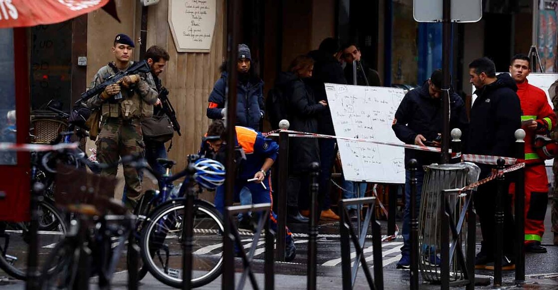 French police secure a street after gunshots were fired killing three people and injuring several in a central district of Paris, France on Friday. Photo: Reuters/ Sarah Meyssonnier