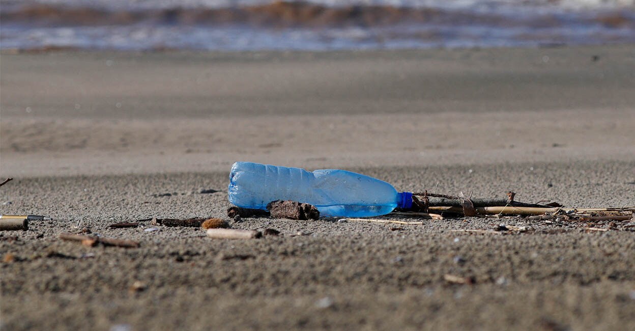 A plastic bottle lies on the sand at Maccarese beach, west of Rome, Italy | Photo:. REUTERS/Max Rossi