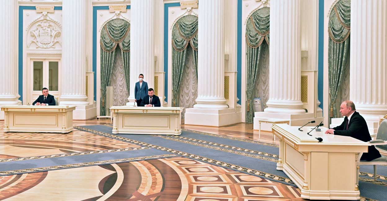 Russian President Vladimir Putin Russian President Vladimir Putin attends a ceremony to sign documents, including a decree recognising two Russian-backed breakaway regions in eastern Ukraine as independent entities, with leaders of the self-proclaimed republics Leonid Pasechnik and Denis Pushilin seen in the background, in Moscow, Russia, in this picture released February 21, 2022. Photo: Sputnik/Alexey Nikolsky/Kremlin/Reuters