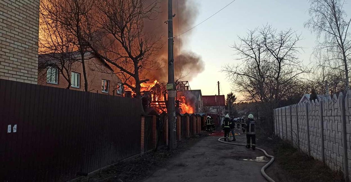 Firefighters work at residential buildings damaged by shelling, as Russia's invasion of Ukraine continues, in Kyiv, Ukraine, in this handout picture obtained by Reuters on March 16, 2022.  Press service of the State Emergency Service of Ukraine/Handout via Reuters