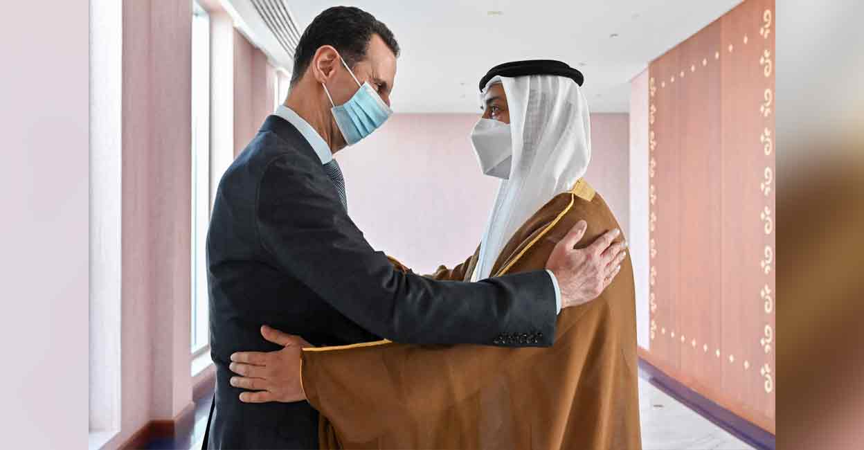 A handout picture released by the United Arab Emirates' Ministry of Presidential Affairs shows Syria's President Bashar al-Assad (left) being greeted by Sheikh Mansour bin Zayed Al Nahyan, UAE Deputy Prime Minister and Minister of Presidential Affairs , in the capital Abu Dhabi on Friday. Photo: AFP