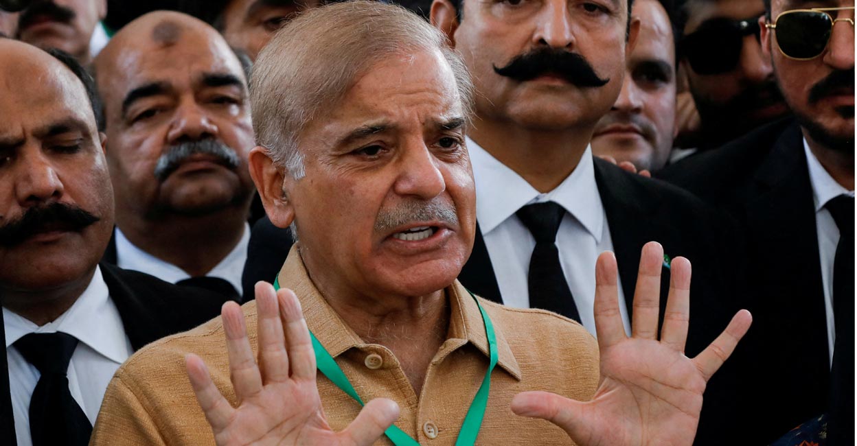 FILE PHOTO: Leader of the opposition Mian Muhammad Shehbaz Sharif, brother of ex-Prime Minister Nawaz Sharif, gestures as he speaks to the media at the Supreme Court of Pakistan in Islamabad, Pakistan April 7, 2022. REUTERS/Akhtar Soomro/File Photo