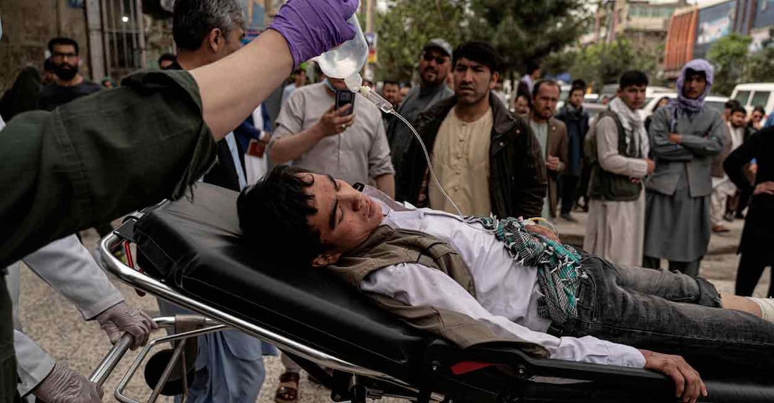 Kabul bomb blasts Medical staff move a wounded youth on a stretcher outside a hospital in Kabul on Tuesday after two bomb blasts rocked a boys' school in a Shiite Hazara neighbourhood. Photo: AFP