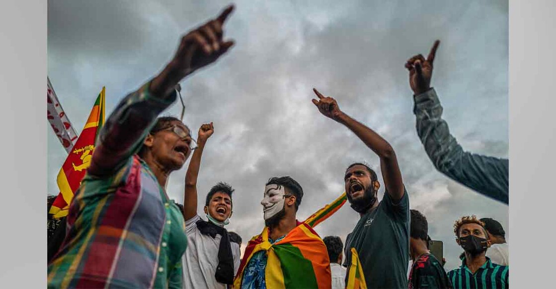 Protesters shout slogans during an ongoing anti-government demonstration near the president's office in Colombo on Tuesday. Photo: AFP