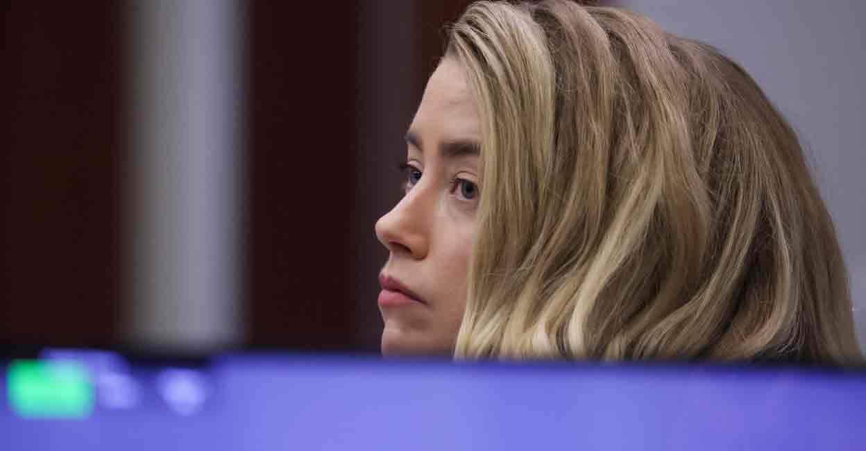 Amber Heard Actor Amber Heard attends her ex-husband Johnny Depp's defamation trial against her, at the Fairfax County Circuit Courthouse in Fairfax, Virginia, U.S., April 20, 2022. REUTERS/Evelyn Hockstein/Pool