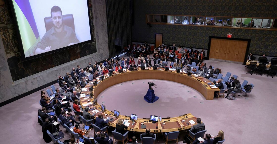 Ukrainian President Volodymyr Zelenskiy appears on a screen as he addresses the United Nations Security Council via video link during a meeting, amid Russia's invasion of Ukraine, at the United Nations Headquarters in Manhattan, New York City, New York, US, April 5, 2022. PHOTO: Reuters/Andrew Kelly