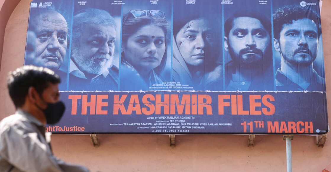 A man walks past a poster of the Bollywood movie 'The Kashmir Files' outside a cinema in Mumbai, India. File Photo: Reuters/Francis Mascarenhas
