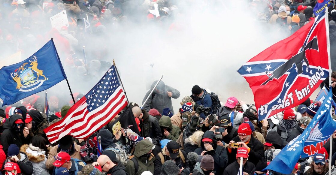 Tear gas is released into a crowd of protesters during clashes with Capitol police at a rally to contest the certification of the 2020 US presidential election results at the Capitol Building in Washington, US, January 6, 2021. FILE PHOTO: Reuters/Shannon Stapleton