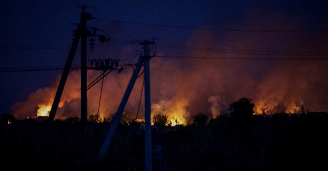 Houses burn after shelling, as Russia's attack on Ukraine continues, in the town of Marinka, in Donetsk region, Ukraine June 3, 2022. PHOTO: Reuters/Anna Kudriavtseva
