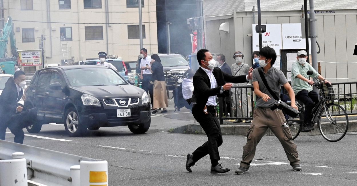 A police officer detains a man, believed to have shot former Japanese Prime Minister Shinzo Abe, in Nara, western Japan July 8, 2022 in this photo taken by The Asahi Shimbun. FILE PHOTO: Reuters