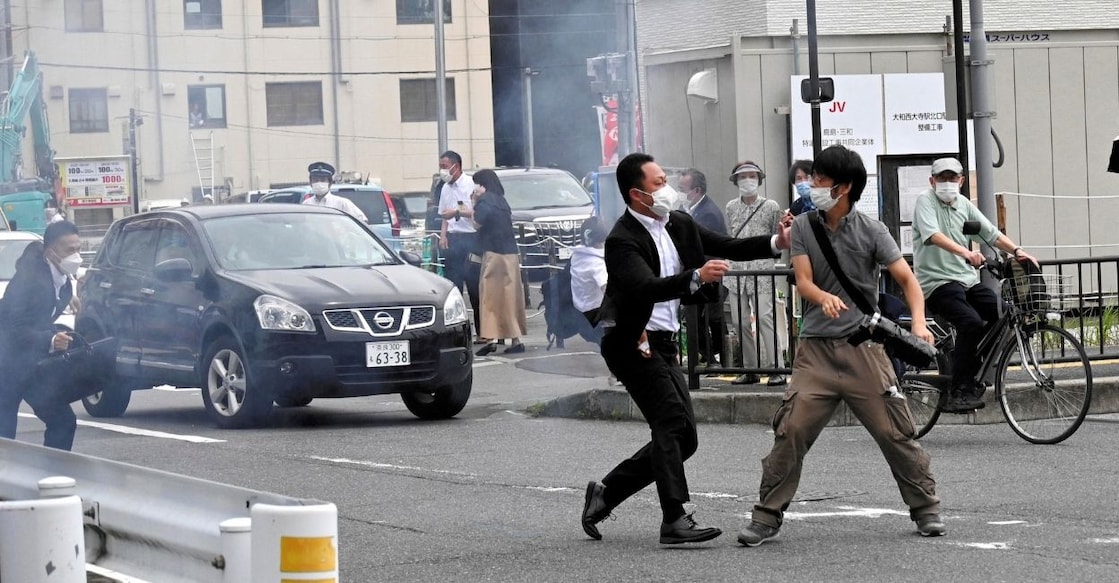 A police officer detains a man, believed to have shot former Japanese Prime Minister Shinzo Abe, in Nara, western Japan July 8, 2022 in this photo taken by The Asahi Shimbun. FILE PHOTO: Reuters