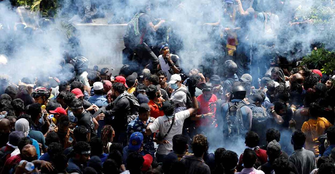 Demonstrators gather outside the office of Sri Lanka's Prime Minister Ranil Wickremesinghe, amid the country's economic crisis, in Colombo, Sri Lanka July 13, 2022. REUTERS/Adnan Abidi