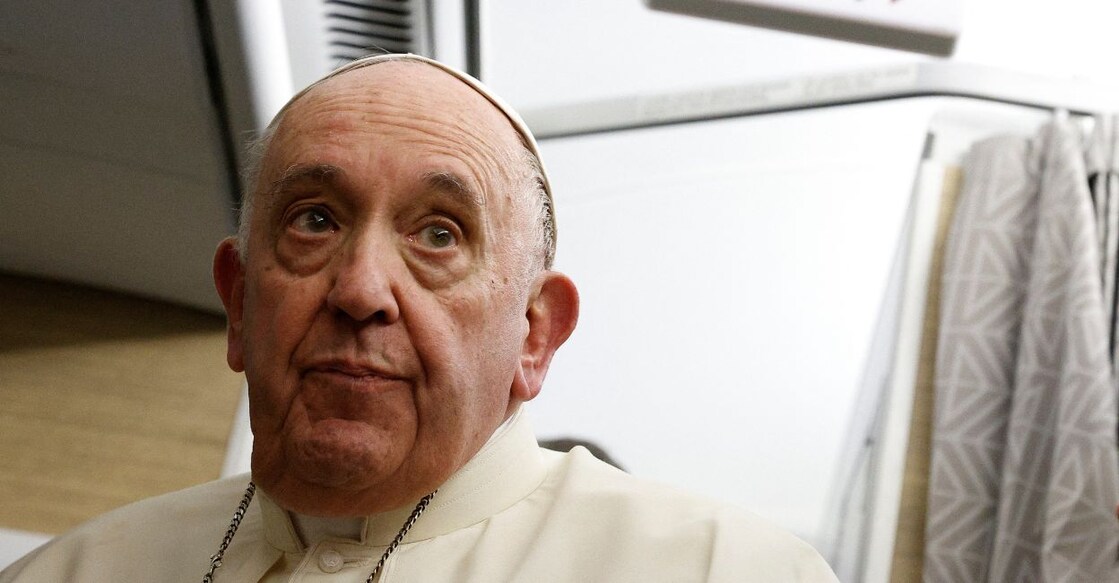 Pope Francis holds a news conference aboard the papal plane on his flight back after visiting Canada, July 29, 2022. PHOTO: Reuters