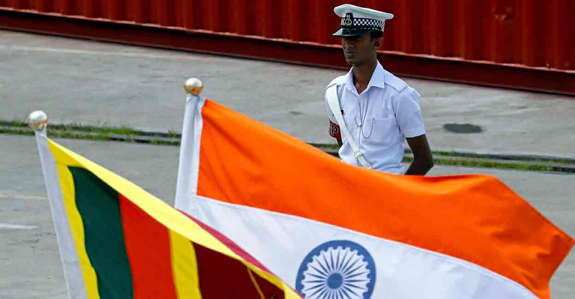A Navy officer stands in front of India's and Sri Lanka's national flags as Indian Coast Guard Ship (ICGS) Shoor is in the Colombo port during its visit in Colombo, Sri Lanka April 2, 2018. File photo: REUTERS/Dinuka Liyanawatte