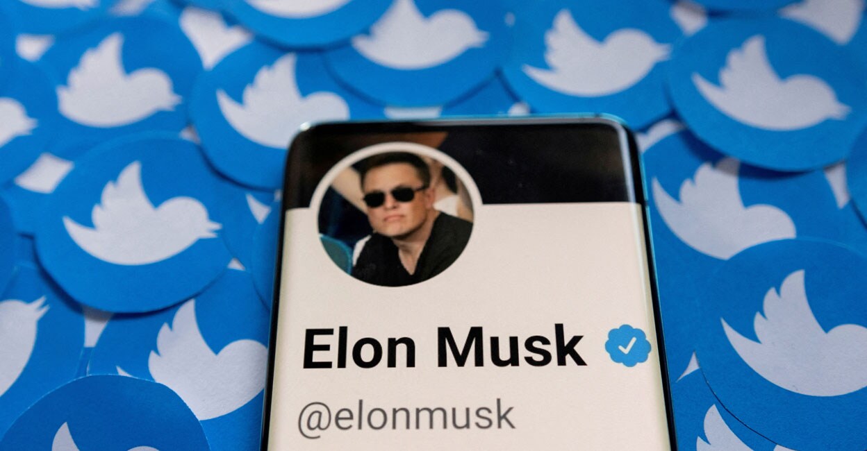 Elon Musk's Twitter profile is seen on a smartphone placed on printed Twitter logos in this picture. Illustration: Reuters/ Dado Ruvic