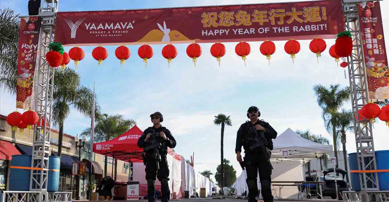 Police officers guard the area near the location of a shooting that took place during a Chinese Lunar New Year celebration, in Monterey Park, California, U.S. January 22, 2023. REUTERS/Mike Blake