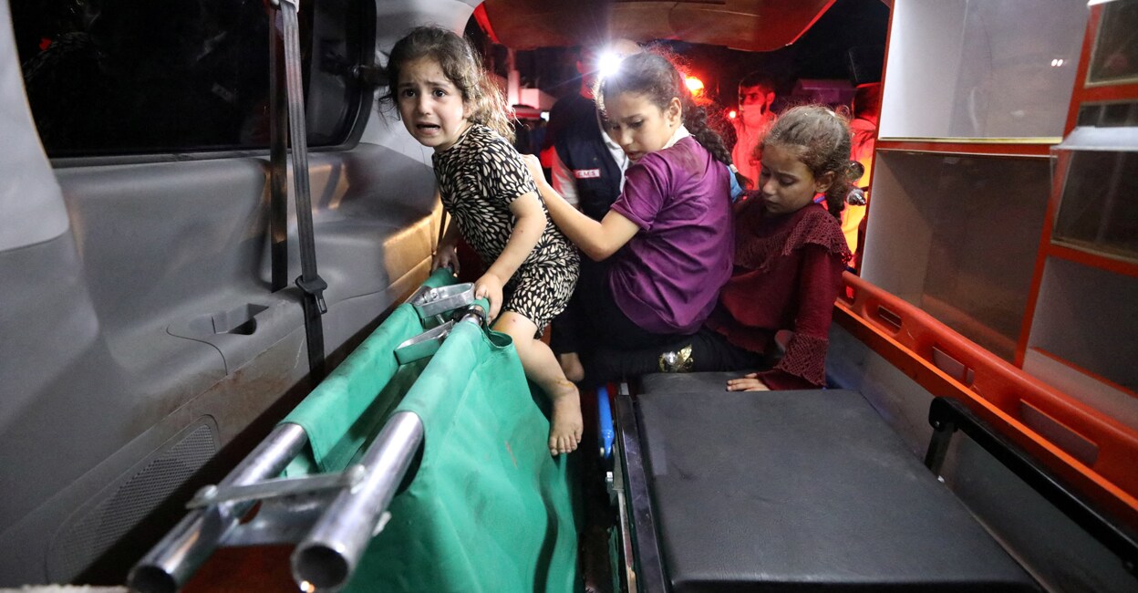 palastine-hospital-israeli-attack-add-2 Children sit in the back of an ambulance at Shifa Hospital after an Israeli air strike hit the nearby Al-Ahli Hospital, according to Gaza Health Ministry in Gaza City, Gaza Strip, on Tuesday. Photo: REUTERS/Mohammed Al-Masri