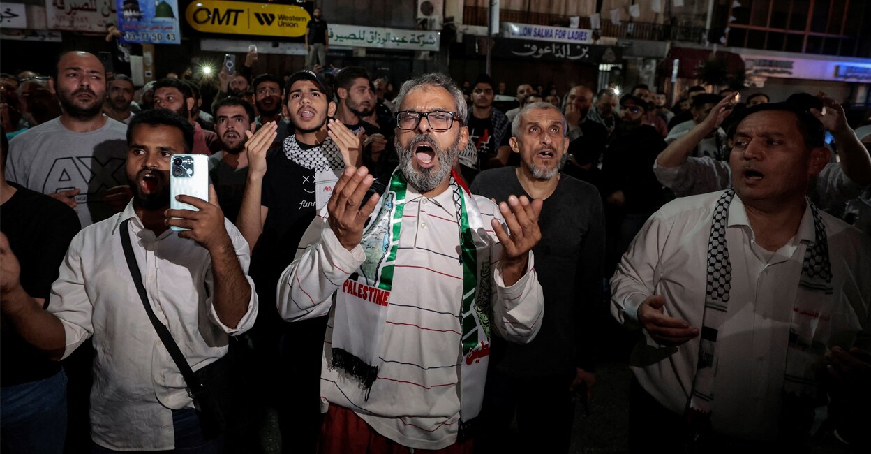 palastine-hospital-israeli-attack-add-3 People pray as they protest after hundreds of Palestinians were killed in a blast at Al-Ahli hospital in Gaza that Israeli and Palestinian officials blamed on each other, in Beirut, Lebanon on Tuesday. Photo: REUTERS/Zohra Bensemra