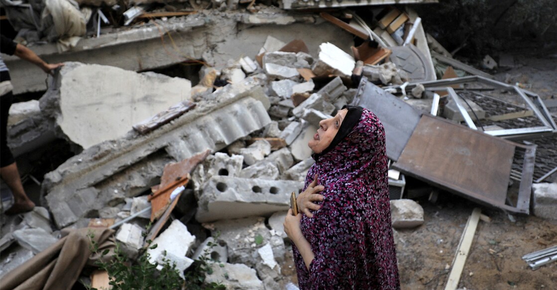 A Palestinian woman reacts at the site of an Israeli strike on a residential building in Gaza City on Wednesday. Photo: REUTERS/Yasser Qudih