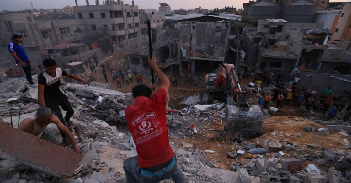 Untitled design - 1 Palestinians search for survivors in the rubble of a building in the Nuseirat refugee camp in the central Gaza Strip on October 31, 2023, amid relentless Israeli bombardment of the Palestinian enclave. Photo: AFP/Mahmud Hams