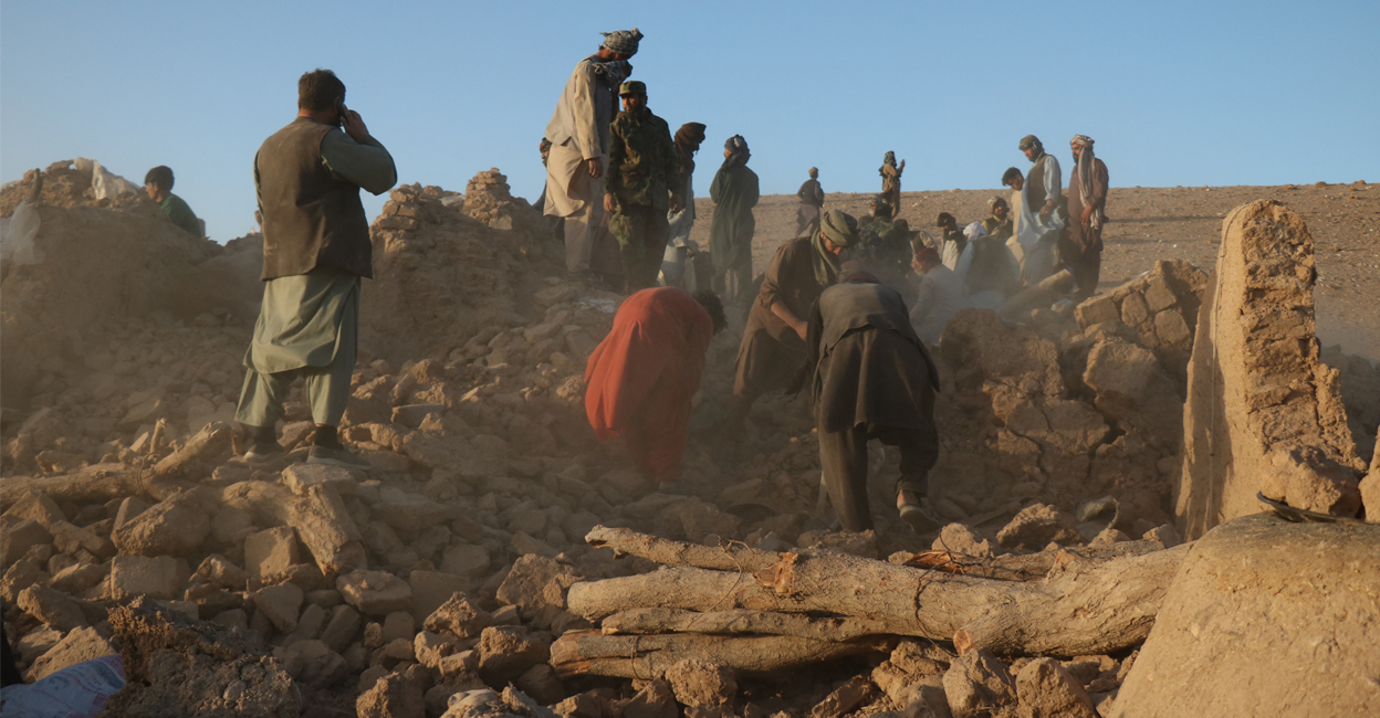 Afghan residents clear debris from a damaged house after earthquake in Sarbuland village of Zendeh Jan district of Herat province on Saturday. Photo: AFP/Mohsen KARIMI