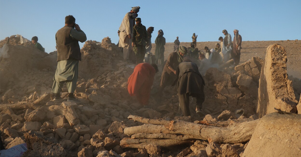 Afghan residents clear debris from a damaged house after earthquake in Sarbuland village of Zendeh Jan district of Herat province on Saturday. Photo: AFP/Mohsen KARIMI