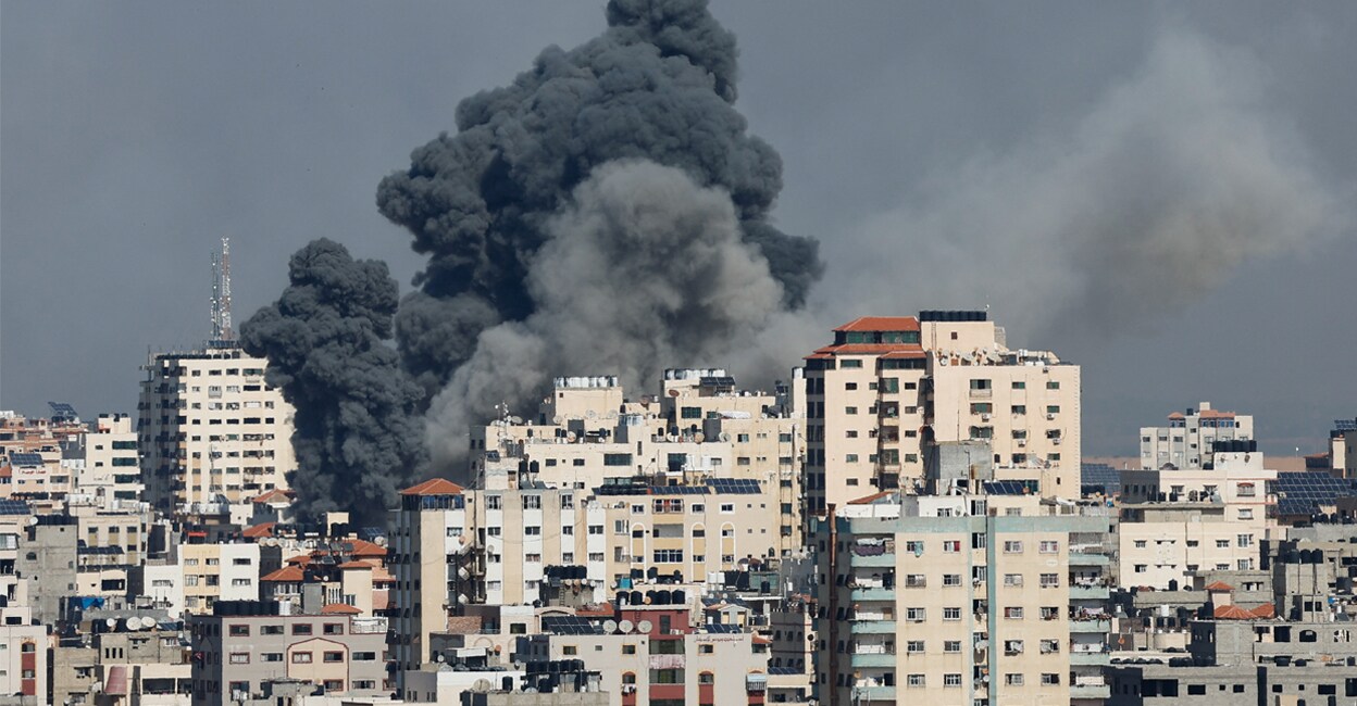hamas-attack-add-1 Smoke rises following Israeli strikes in Gaza on Saturday. Photo: REUTERS/Mohammed Salem