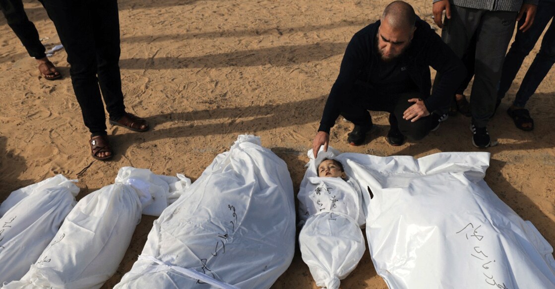 Graphic content: A man mourns at the funeral of a family, including a child, killed in an Israeli strike, in Khan Yunis, in the southern Gaza Strip on November 22, 2023. Photo: AFP/ Mahmud Hams