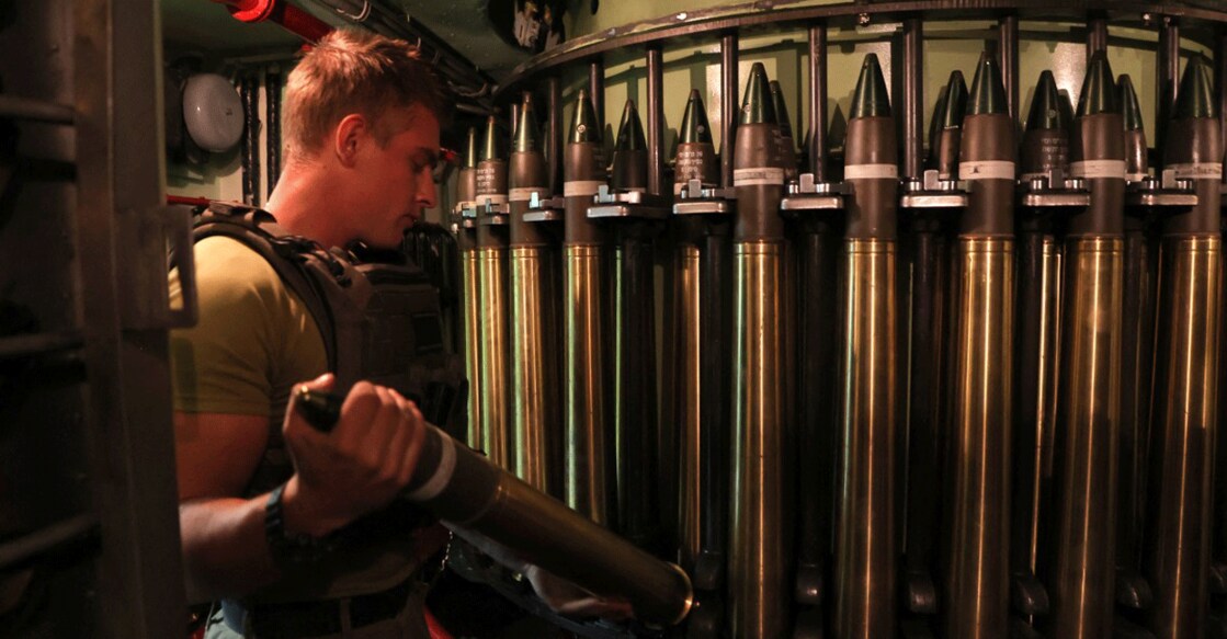 ISRAEL-PALESTINIAN-CONFLICT A picture taken during a guided tour organised by the Israeli Navy on November 23, 2023, shows an Israeli sailor arranging shells aboard a Sa'ar 4.5-class missile boat preparing to depart to patrol off the coast of Gaza from a naval base in the northern port city of Haifa, amid continuing battles between Israel and Hamas. Photo: AFP/Gil Cohen-Magen