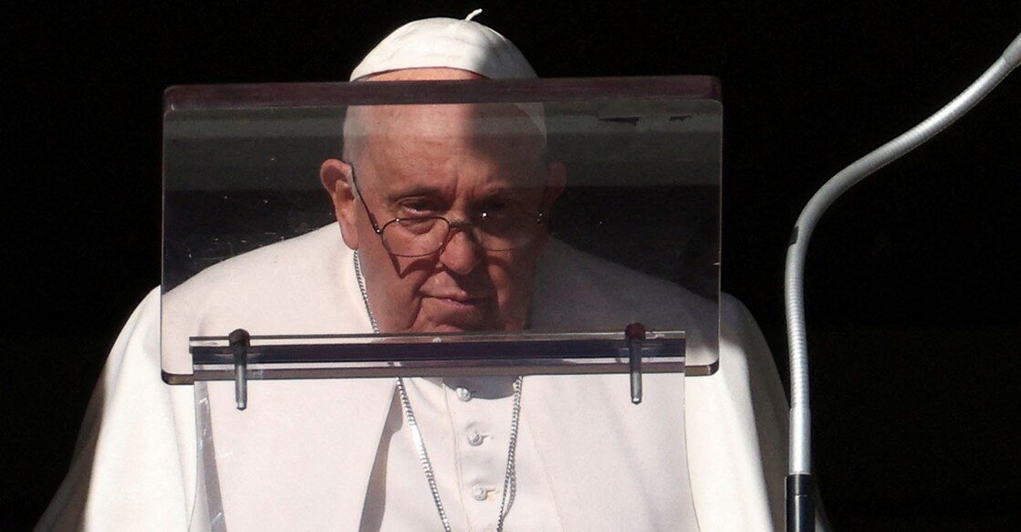 POPE-ANGELUS Pope Francis looks on to lead the Angelus prayer from his window at the Vatican on Sunday. Photo: Reuters/Guglielmo Mangiapane