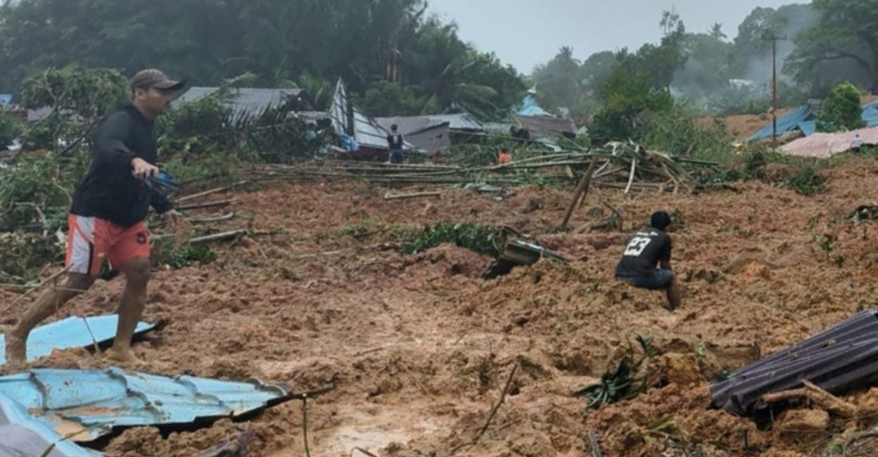 This handout photo taken and released on March 6, 2023, by the BNPB (National Disaster Management Agency) shows people inspecting the damage at a village that was hit by landslides in Natuna in Indonesia's Riau Province. Photo: Handout/BNPB/AFP