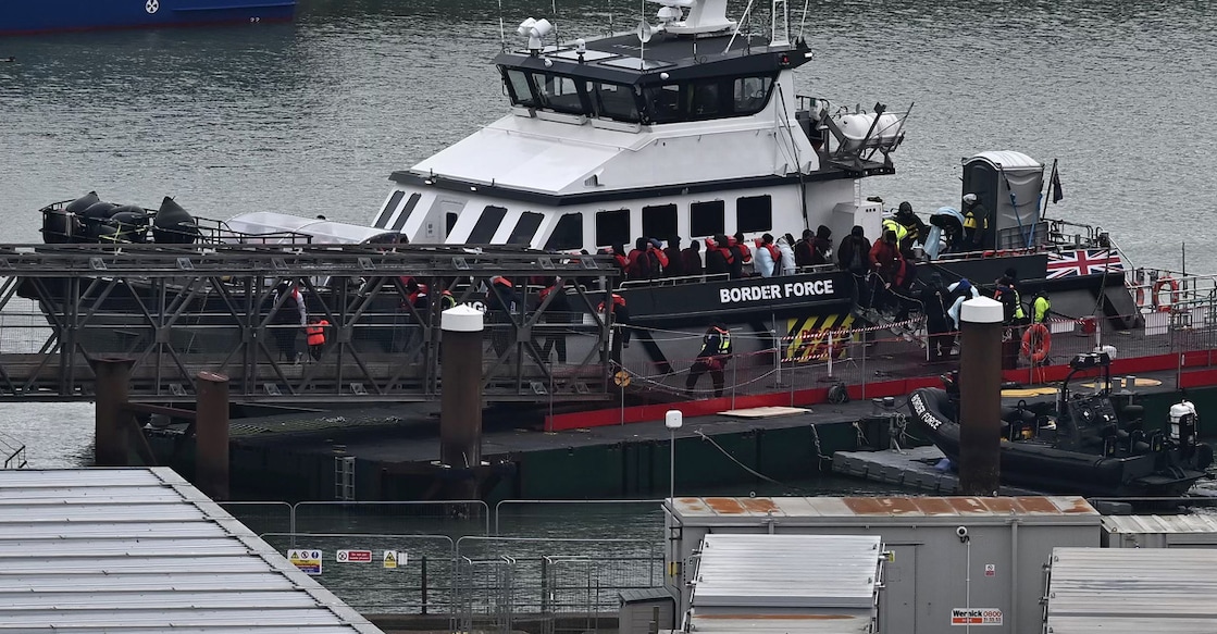 Migrants are escorted ashore from the UK Border Force vessel 'BF Ranger' in Dover, southeast England on March 6, 2023, after having been picked up at sea while attempting to cross the English Channel. File photo: AFP/Ben Stansall