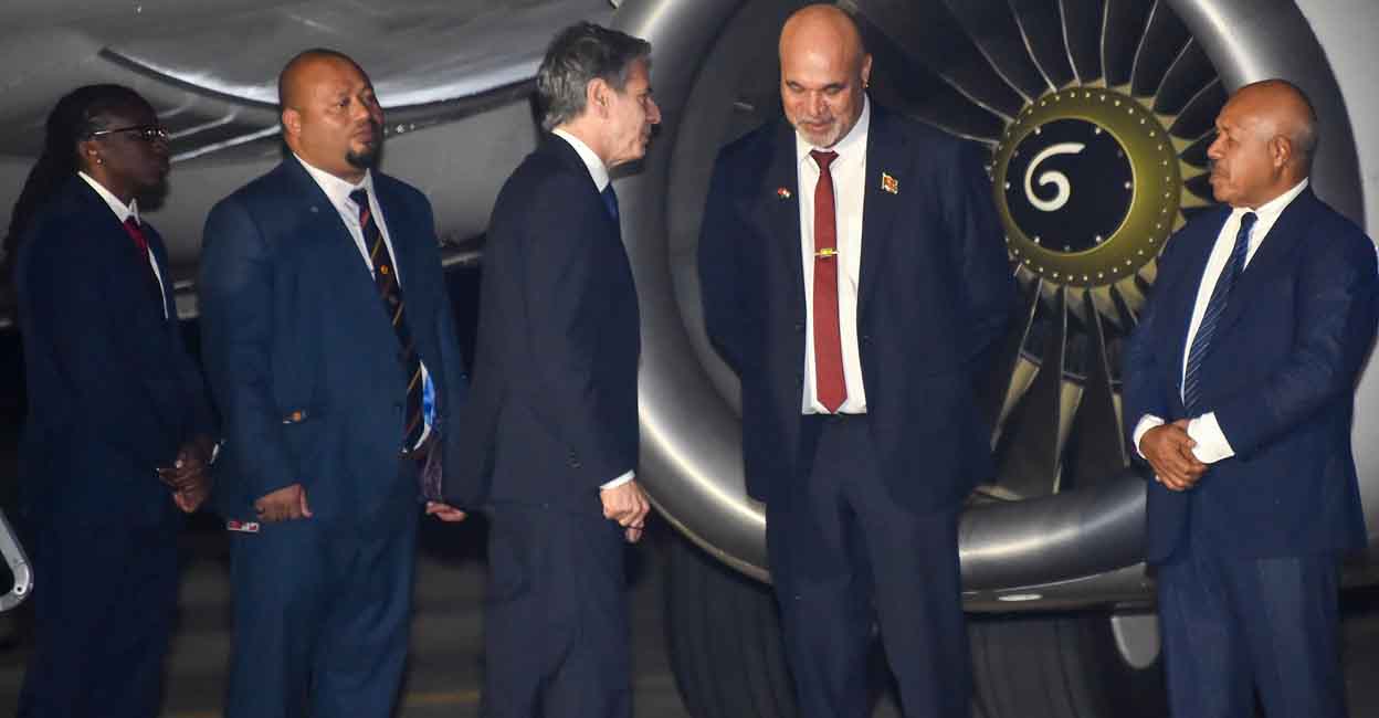 Papua New Guinea's Deputy Prime Minister John Rosso (second right) greets US Secretary of State Antony Blinken (centre) upon his arrival at Port Moresby International Airport on May 21, 2023. Photo: AFP/Andrew Kutan 