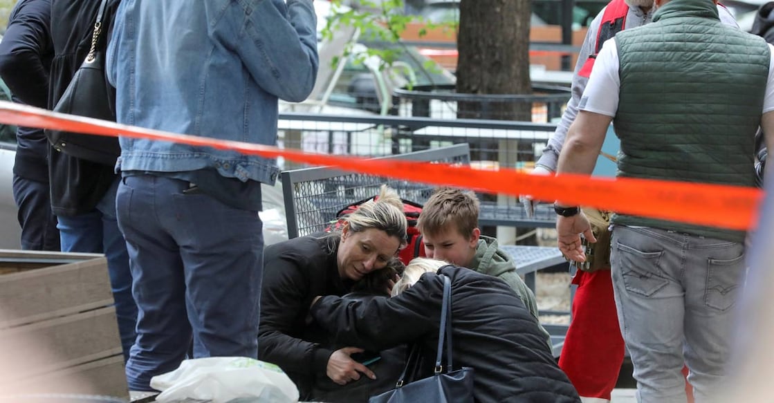 People react after a 14-year-old boy opened fire on other students and security guards at a school in downtown Belgrade, Serbia: Reuters/Djordje Kojadinovic