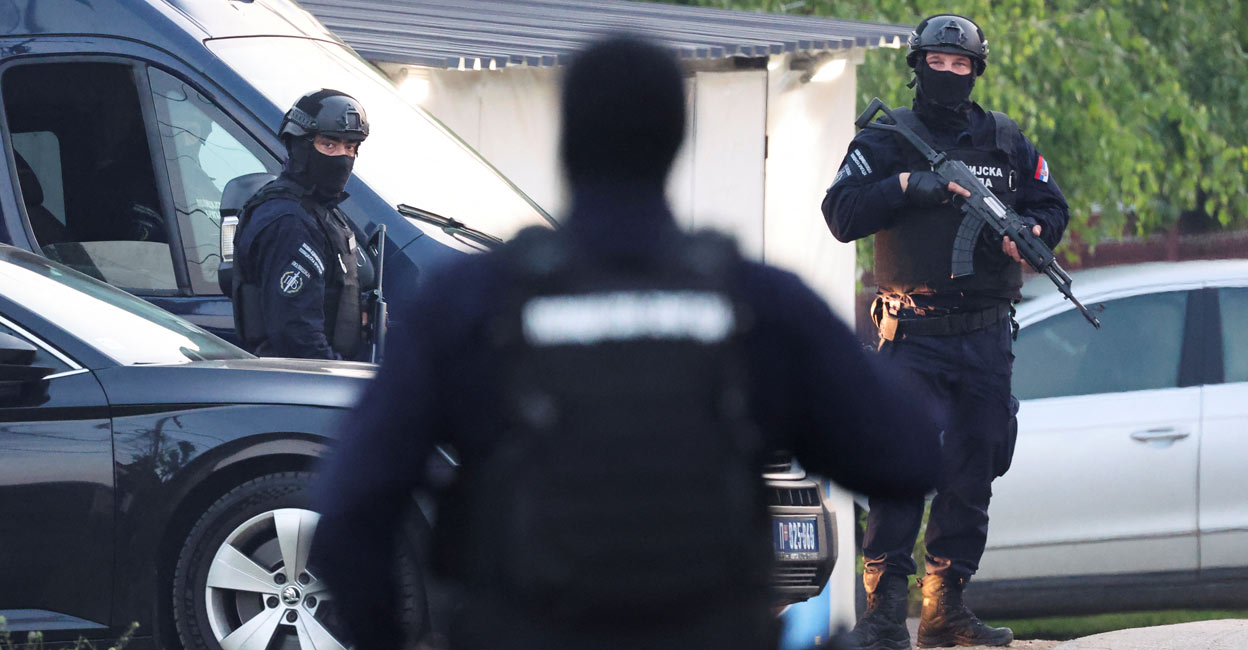 Security personnel operate, in the aftermath of a shooting, in Dubona. Photo: Reuters/Antonio Bronic