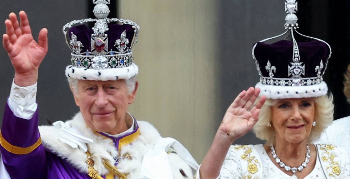 Britain's King Charles and Queen Camilla gesture as they stand on the Buckingham Palace balcony following their coronation ceremony in London. Photo: Reuters