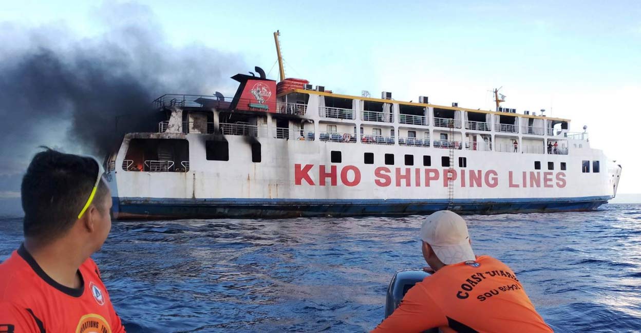 Philippines Ferry Fire Photos and video released by the coast guard show flames and black smoke billowing from two decks at one end of the ferry as coast guard personnel onboard another vessel used a water cannon to try to put out the fire. Photo: Philippine Coast Guard via AP
