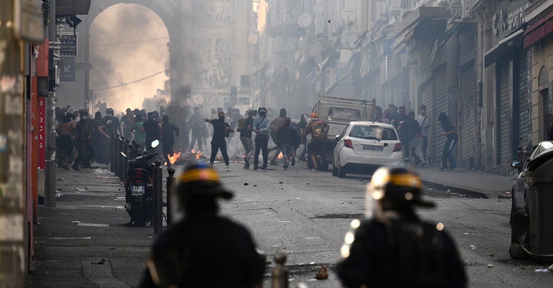 Protesters clash with CRS riot police at the Porte d'Aix in Marseille, southern France on Friday over the shooting of a teenage driver by French police in a Paris suburb on June 27. The unrest has come in response to the killing of 17-year-old Nahel, whose death has revived longstanding grievances about policing and racial profiling in France's low-income and multi-ethnic suburbs. Photo: AFP/Christophe Simon