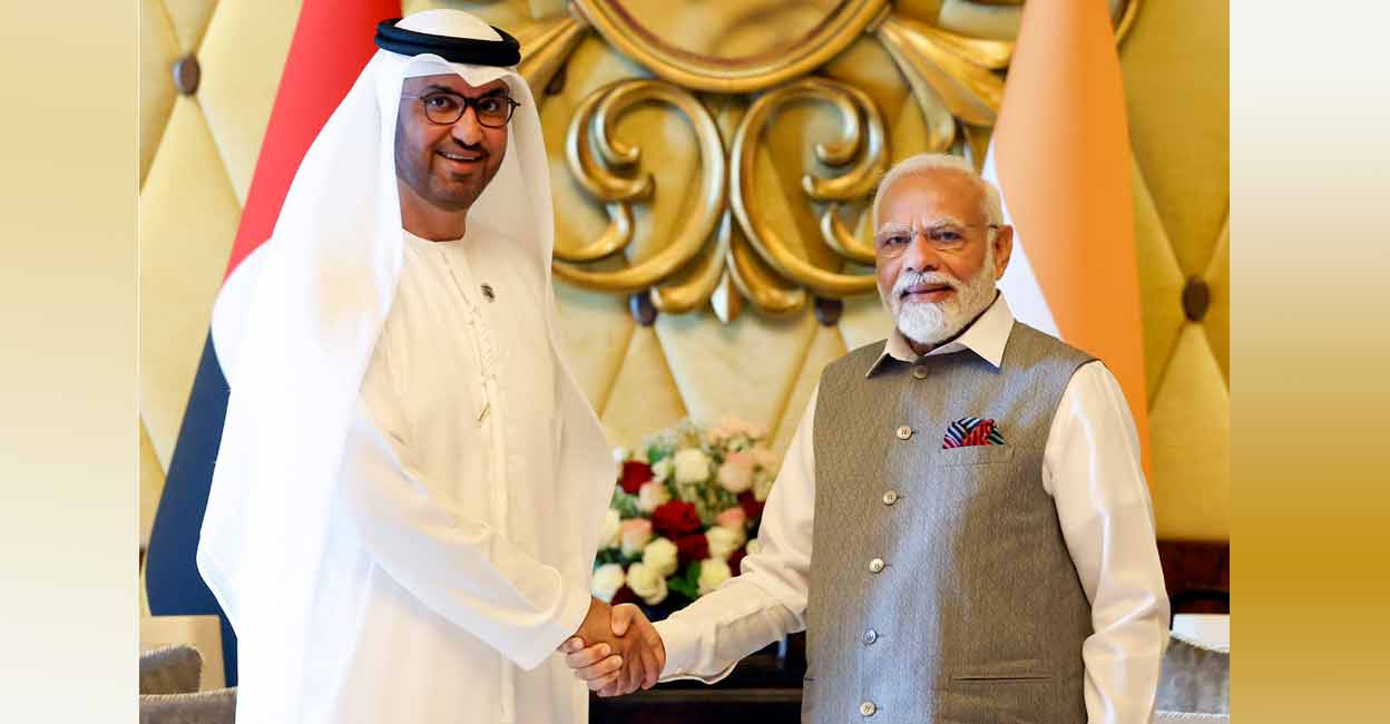 PTI07_15_2023_000113B Prime Minister Narendra Modi and president-designate of the 28th session of the UN Climate Change (COP28 in UAE) Sultan Al Jaber during a meeting, in Abu Dhabi, Saturday, July 15, 2023. Photo: Twitter/Narendra Modi