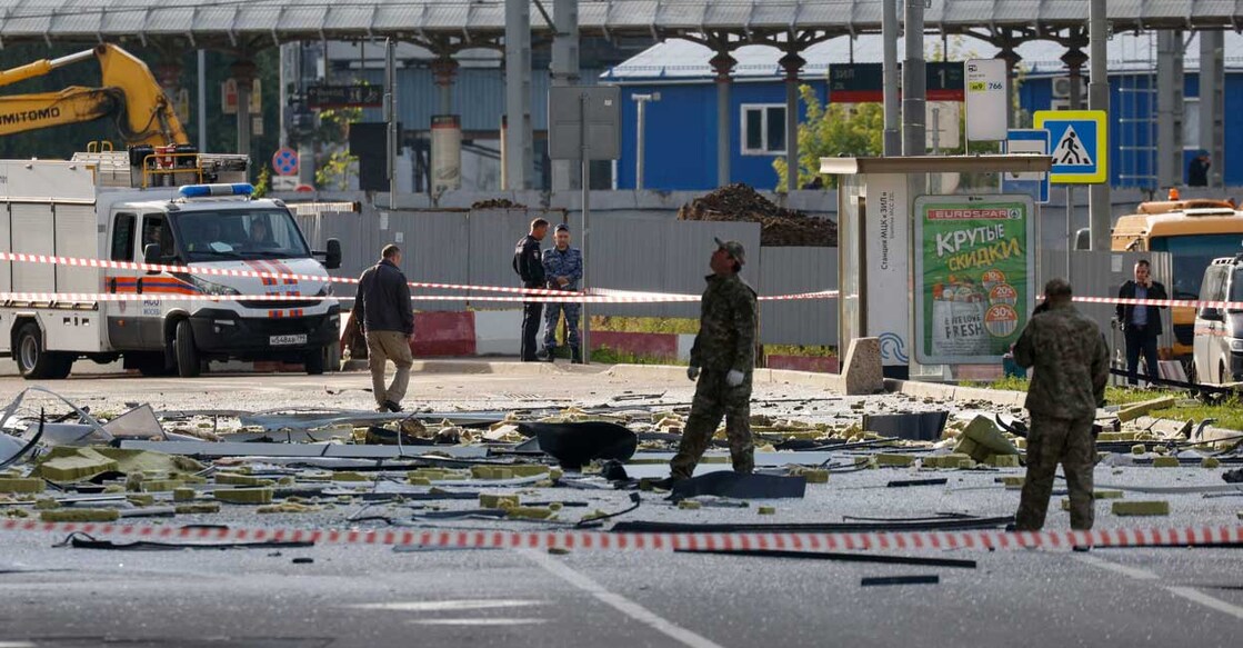 Members of the security services investigate the site of a damaged building following a reported drone attack in Moscow. Photo: Reuters/Maxim Shemetov