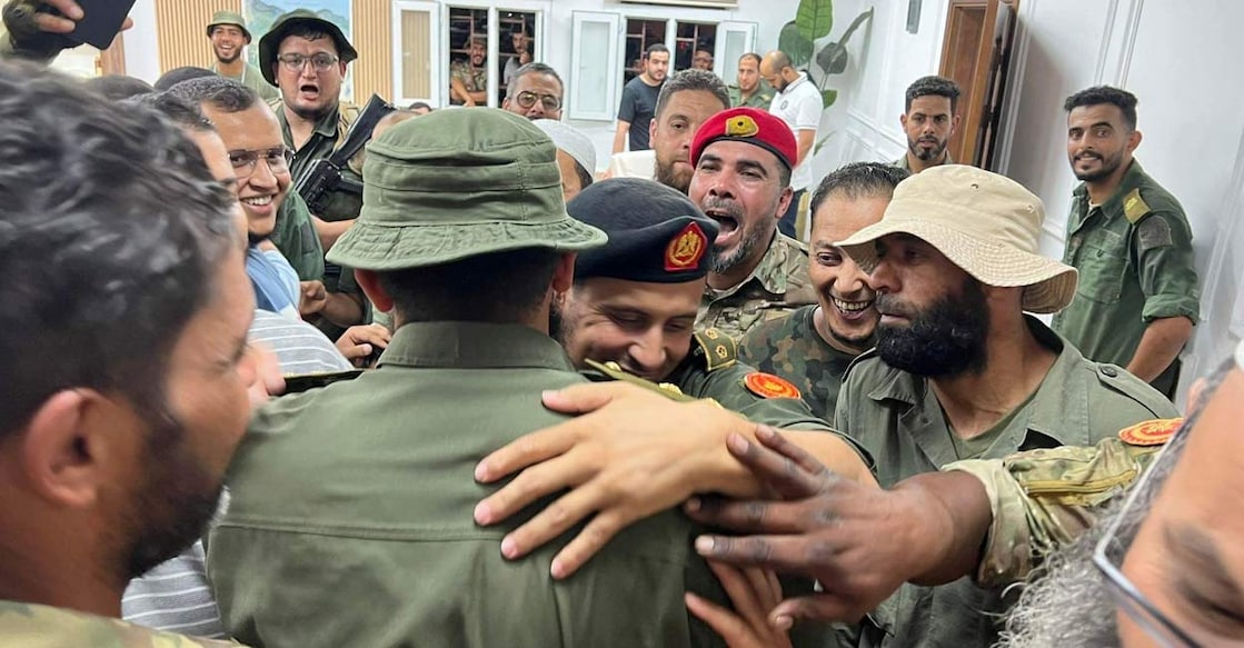 LIBYA-CLASHES Members of the 444th Brigade receive commander Mahmoud Hamza, who was arrested during the clashes as he attempted to travel from Mitiga airport, in Tripoli, Libya, August 17, 2023. The city witnessed violent clashes between armed factions because of him. 444th Brigade/Handout via REUTERS