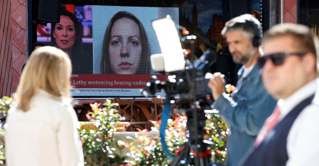 Members of the media work near a large screen showing a picture of convicted hospital nurse Lucy Letby, ahead of her sentencing, outside the Manchester Crown Court, in Manchester, Britain, on Monday. Photo: REUTERS/Phil Noble