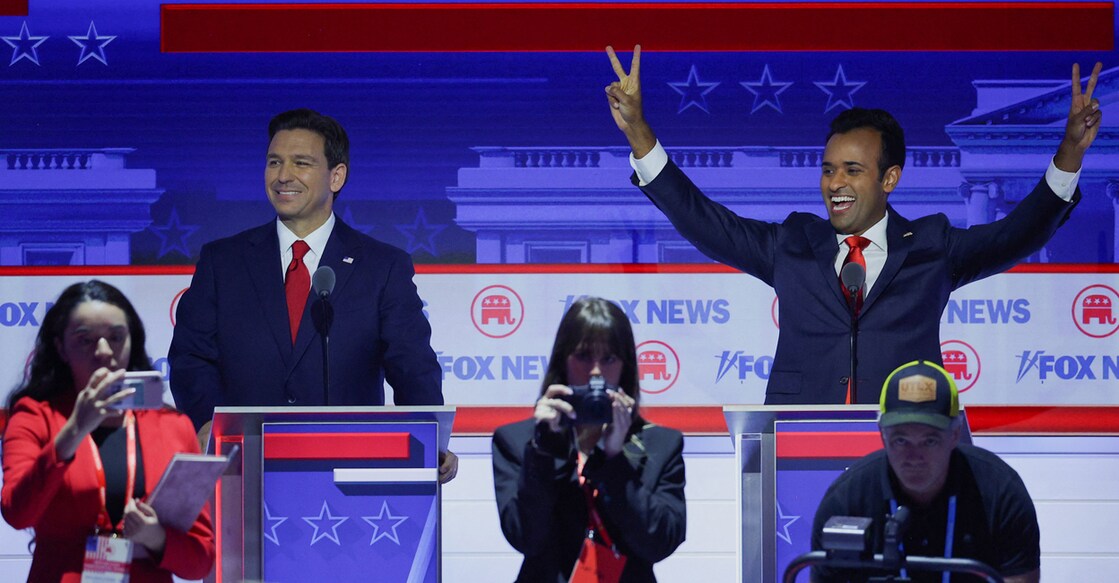 USA-ELECTION-REPUBLICANS-DEBATE Florida Governor Ron DeSantis stands behind his podium as former biotech executive Vivek Ramaswamy gestures at the first Republican candidates' debate of the 2024 US presidential campaign in Milwaukee, Wisconsin on Wednesday. Photo: Reuters/Brian Snyder