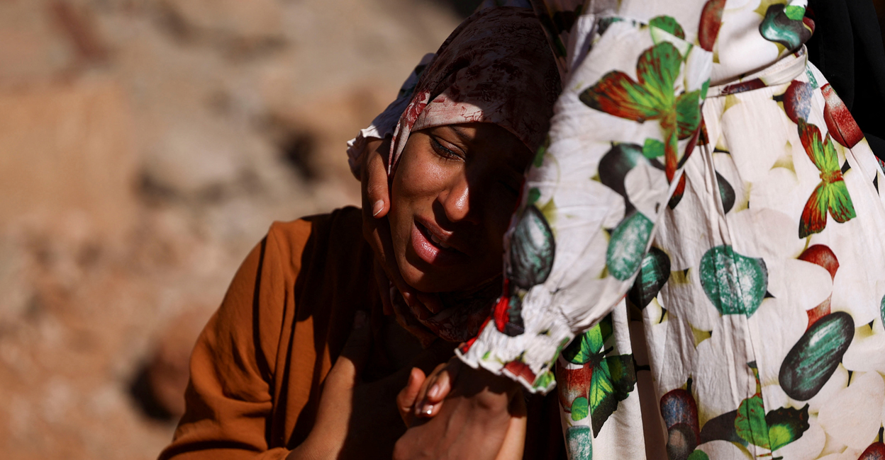 A relative reacts as rescue workers recover one body from the rubble, in the aftermath of a deadly earthquake in Ouirgane, Morocco. Photo: Reuters/Hannah McKay
