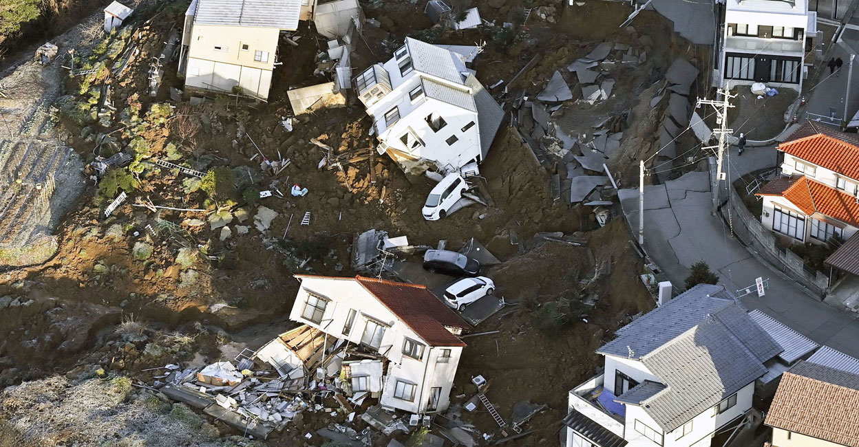An aerial view shows collapsed houses, cars and roads caused by an earthquake in Kanazawa, Japan. Photo: Reuters 